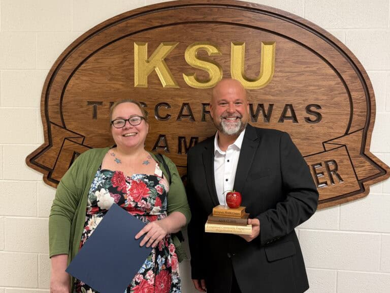 JJ Boroski and Sara Kenosky accepting the Exceptional Community Engagement Partner Award on behalf of SpringVale Health Centers